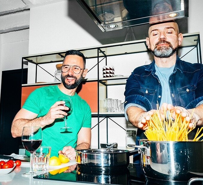 Two men cooking dinner